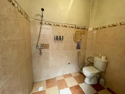 a bathroom with a toilet and a shower at Happy Marrakchy in Marrakech
