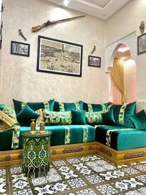 a living room with a blue couch in a room at Riad Dar IMANE in Marrakech