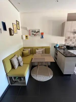 a living room with a couch and a table at Marrakech M Avenue terrasse jardin in Marrakech
