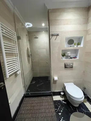 a bathroom with a shower and a toilet at Marrakech M Avenue terrasse jardin in Marrakech