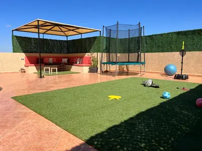 a rendering of a playground with a trampoline at Marrakech le joyau villa piscine privée jardin in Marrakech