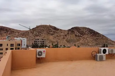 a view of a mountain from the roof of a building at Duplex haut standing, 3 chambres ,Marrakech,gueliz in Marrakech