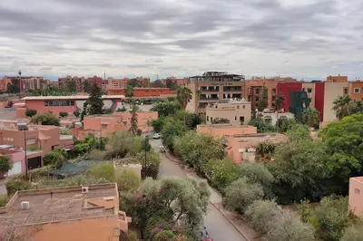 a city with buildings and trees and a street at Duplex haut standing, 3 chambres ,Marrakech,gueliz in Marrakech
