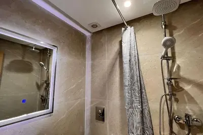 a shower in a bathroom with a shower curtain at Duplex haut standing, 3 chambres ,Marrakech,gueliz in Marrakech