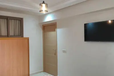 a room with a flat screen tv on a wall at Duplex haut standing, 3 chambres ,Marrakech,gueliz in Marrakech