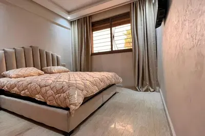 a bedroom with a bed and a window at Duplex haut standing, 3 chambres ,Marrakech,gueliz in Marrakech