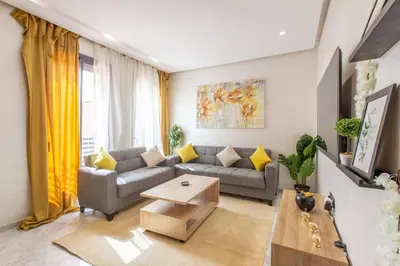 a living room with a couch and a table at New! Marvellous'n modern flat in Marrakech