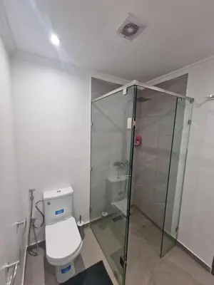 a bathroom with a toilet and a shower at appartement de luxe face la marllette in Marrakech