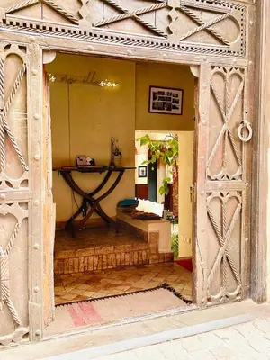 an entrance to a room with an open door at Exclusive and stylish 4-bedroom Riad with plunge pool in Marrakech