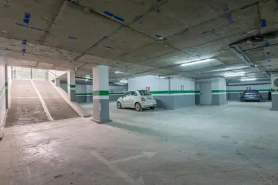 a parking garage with two cars parked in it at New! lovely and cosy flat, like at home in Marrakech