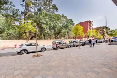a parking lot with cars parked on the street at New! lovely and cosy flat, like at home in Marrakech