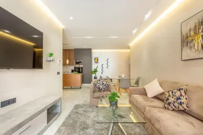 a living room with a couch and a table at New! lovely and cosy flat, like at home in Marrakech