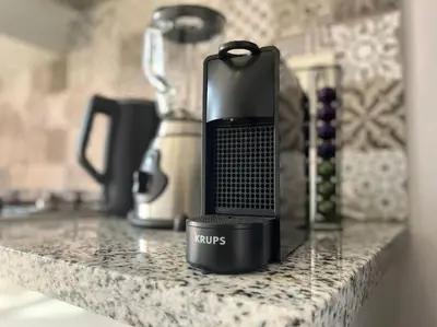 a cell phone sitting on top of a kitchen counter at Lovely family condo in residence Marrakech in Marrakech