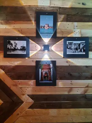 a group of photos on a wooden ceiling with pictures at studio funny house près de la grande place jamaa el fna in Marrakech