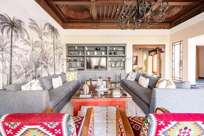 a living room with two couches and a table at Villa May sur le Golf de la Palmeraie with Cooker and Butler included in Marrakech