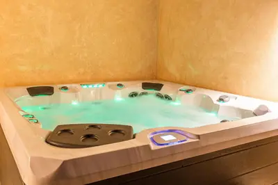 a jacuzzi tub in a corner of a room at VILLA 103 - Luxury Getaway - Private Jacuzzi in Marrakech