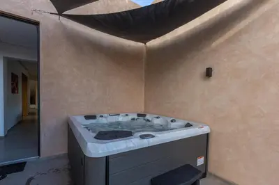 a jacuzzi tub in the corner of a bathroom at VILLA 103 - Luxury Getaway - Private Jacuzzi in Marrakech