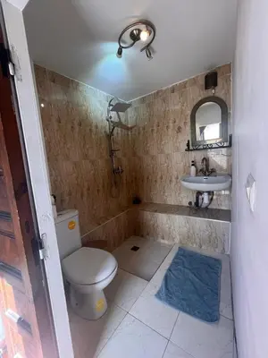 a bathroom with a toilet and a sink at riad dar saba shika in Marrakech