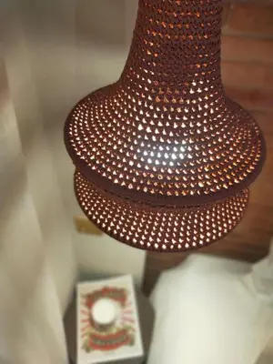 a brown lamp with white lights on it next to a box at Riad Doum Collection 1 in Marrakech