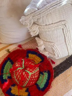 a red apple sitting on top of a rug at RIAD DAR NAOMI in Marrakech
