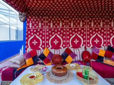 a room with a table with a cake on it at Riad Zehar 79 & Spa in Marrakech