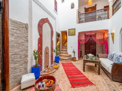 a living room with a couch and a table at Riad Zehar 79 & Spa in Marrakech