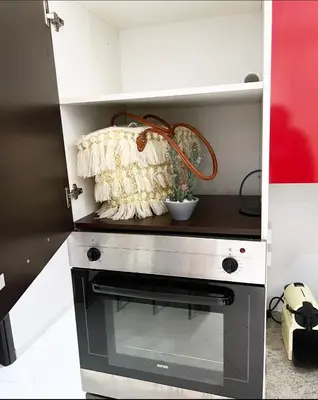 a small kitchen with a stove in a room at Nice new apartment in the city center in Marrakech
