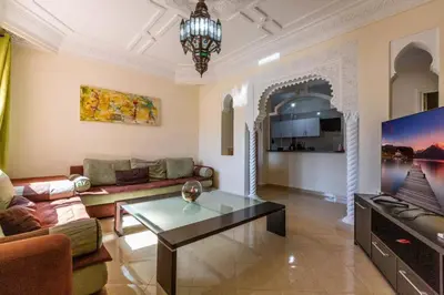 a living room with a couch and a coffee table at Appartement 2 chambres in Marrakech