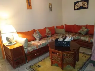 a living room with a couch and a table at Dar Khadija Familly in Marrakech