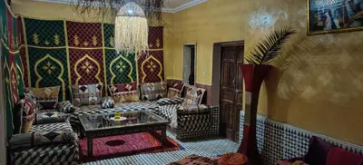a living room with a couch and a table at Dar saafia in Marrakech