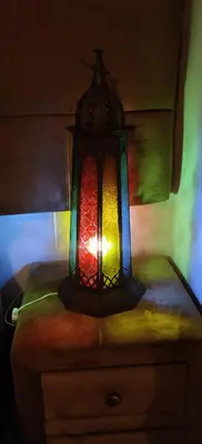 a colorful lamp on top of a dresser at Dar saafia in Marrakech