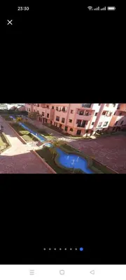 two pictures of a river in front of a building at appaartement M23 premium village in Marrakech