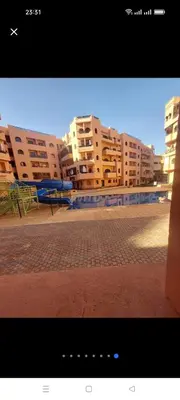 a view of some apartment buildings in a city at appaartement M23 premium village in Marrakech