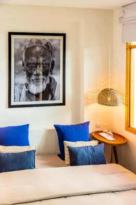 a bedroom with a black and white picture of a man at Pure House Marrakech in Marrakech