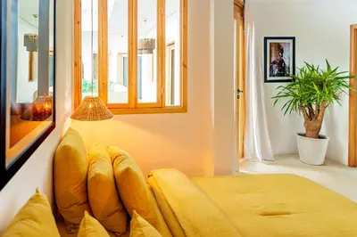 a living room with a couch and a window at Pure House Marrakech in Marrakech