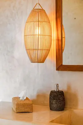 a lamp on top of a table with a box at Pure House Marrakech in Marrakech