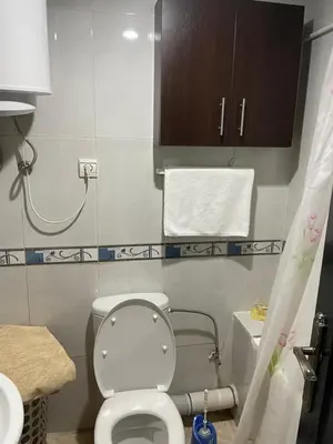 a small bathroom with a toilet and a sink at Appartement 1er étage numéro 6 POUR FAMILLE in Marrakech