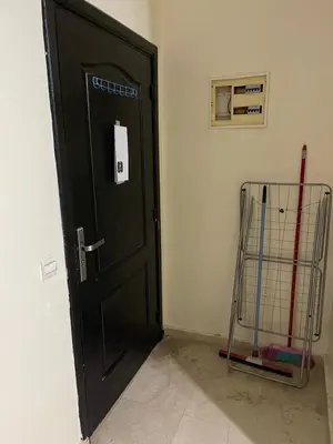 a black door in the corner of a room at Appartement 1er étage numéro 6 POUR FAMILLE in Marrakech