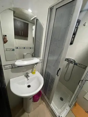 a bathroom with a sink and a shower at Appartement 1er étage numéro 7 POUR FAMILLE in Marrakech