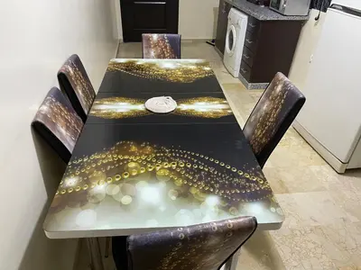 a dining room table with lights on it at Appartement 10 1èr étage. POUR FAMILLE in Marrakech