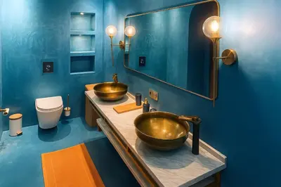 two gold sinks in a bathroom with blue walls at Chic Moroccan Vibes & Pool View - 2BR in Marrakech