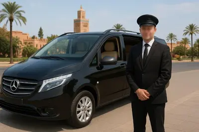 a man in a suit standing next to a car at Chic Moroccan Vibes & Pool View - 2BR in Marrakech