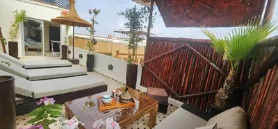 an overhead view of a balcony with stairs and plants at Dar Najat in Marrakech