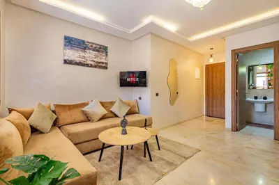 a living room with a couch and a table at favorite in the city center - 100% Equipped in Marrakech