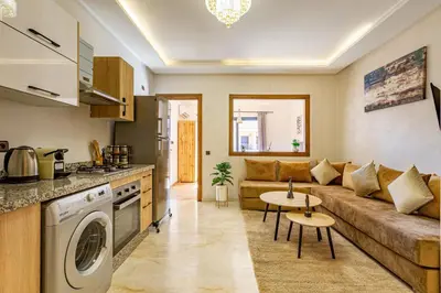 a living room with a couch and a table at favorite in the city center - 100% Equipped in Marrakech