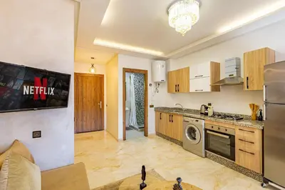 a kitchen with a refrigerator and a stove at favorite in the city center - 100% Equipped in Marrakech
