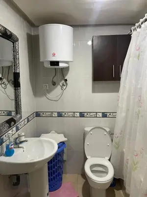 a bathroom with a toilet and a sink at Appartement 18 3èm étage avec balcon ( POUR FAMILLE ) in Marrakech
