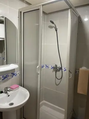 a bathroom with a shower and a sink at Appartement 19 3èm étage ( POUR FAMILLE ) in Marrakech