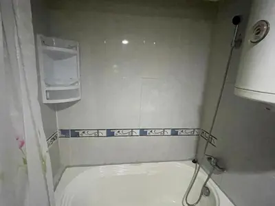 a small bathroom with a sink and a toilet at Appartement 22 au 3ème étage ( POUR FAMILLE ) in Marrakech