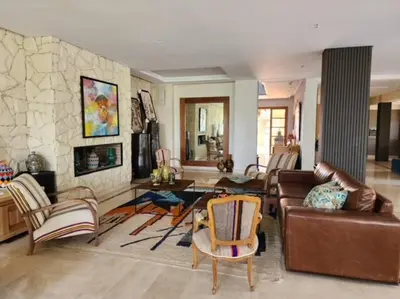 a living room with a couch and a table at Villa de rêve à Marrakech in Marrakech